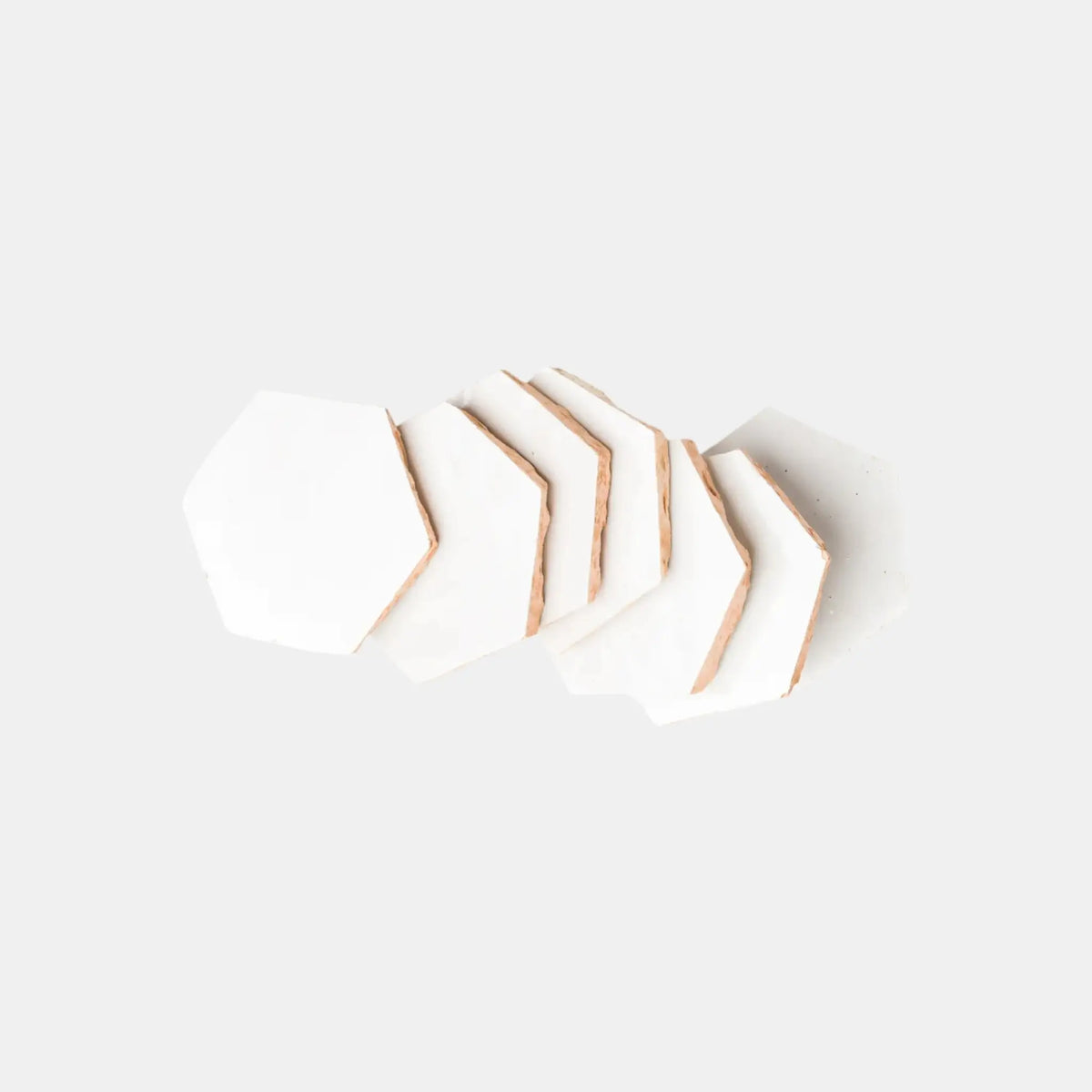 White handmade hexagon zellige tiles crafted from Moroccan terracotta
