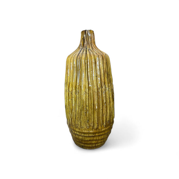 Textured green vase on a white background