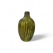 Yellow ribbed vase on a white background