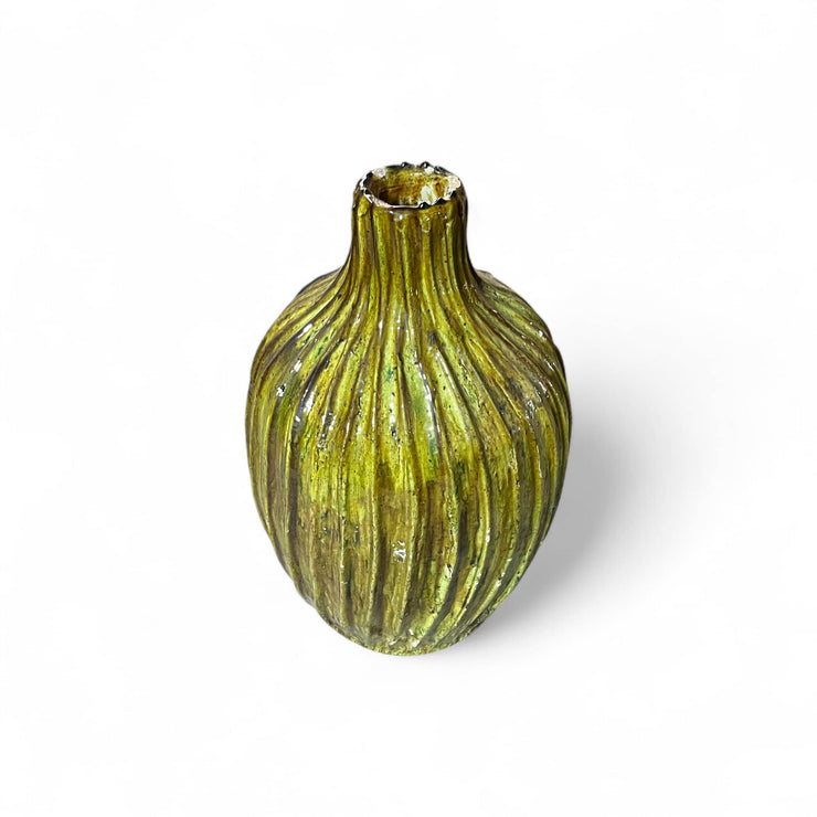 Yellow ribbed vase on a white background