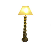 Decorative floor lamp with a textured base and beige shade on a white background