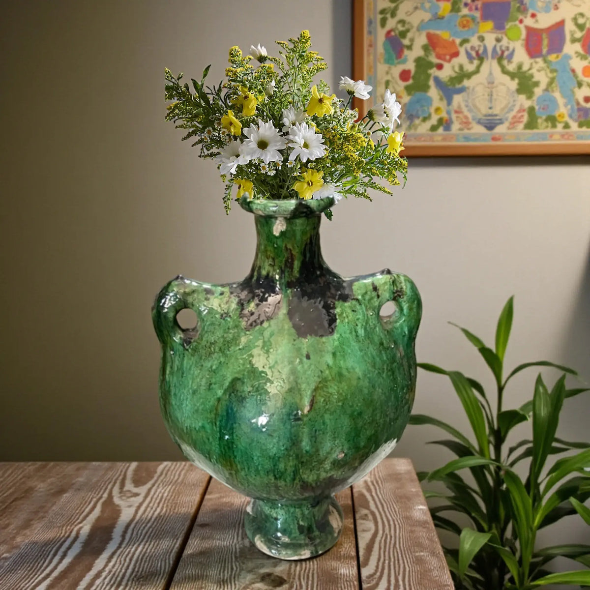 Handmade sculptural Tamegroute ceramic vase with organic open form and natural green  glaze from Morocco