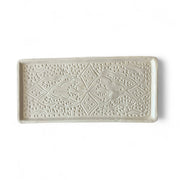 Rectangular ceramic tray with decorative pattern on a white background