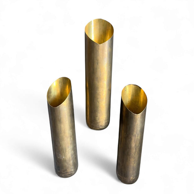 Three brass WALL VASES on a white background