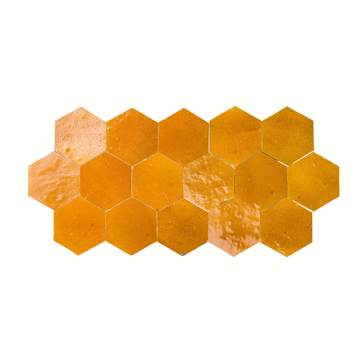 Handmade saffron yellow hexagon Moroccan zellige tiles with natural glaze variation