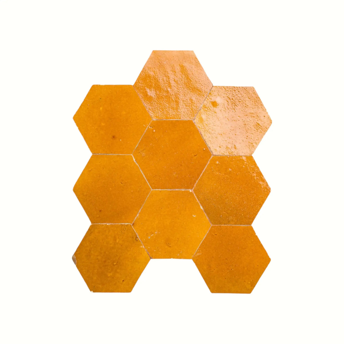 Handmade saffron yellow hexagon Moroccan zellige tiles with natural glaze variation